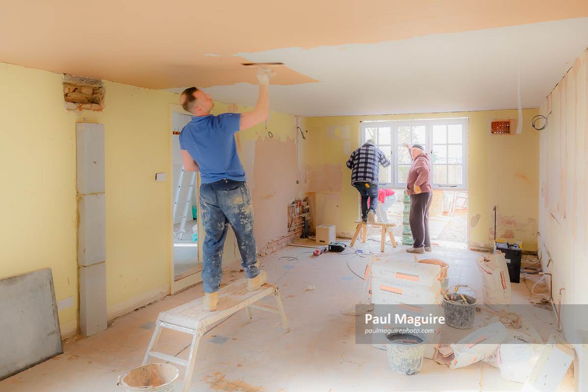 Stock photo Builders renovating house, plasterer plaster skimming