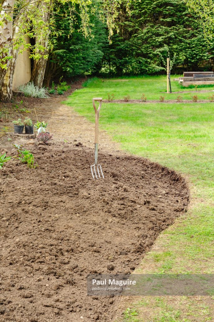 Buy a photo of Digging over a flower bed Paul Maguire