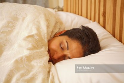 Asian woman in bed