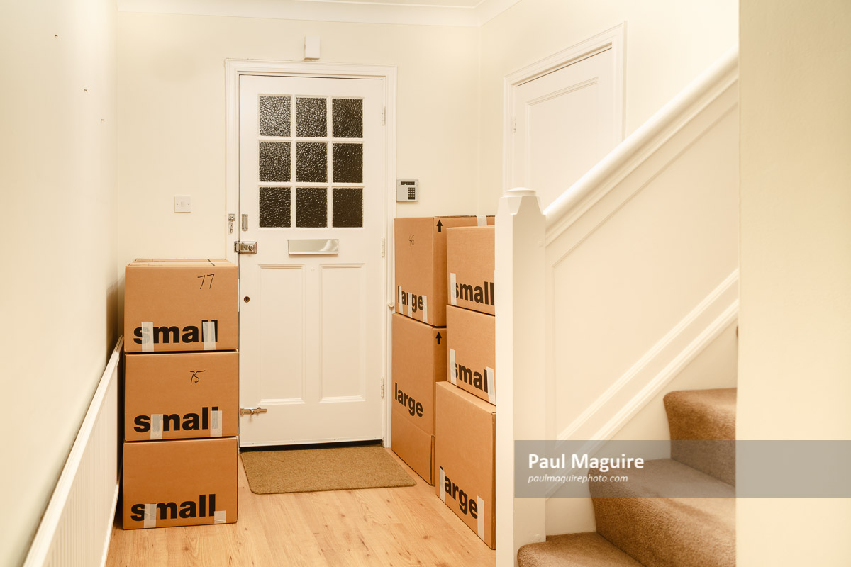 Buy a photo - Cardboard boxes packed for a house move, moving home, UK