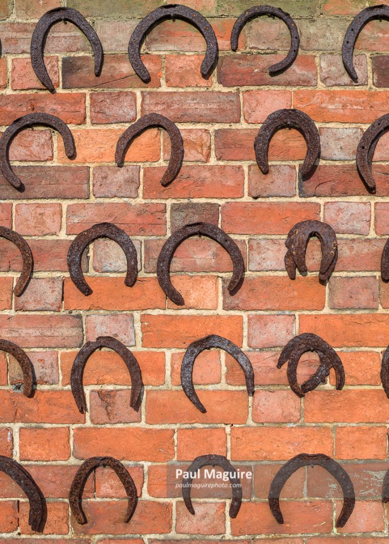 Buy a photo Horseshoes on wall, horseshoe background, UK Paul Maguire