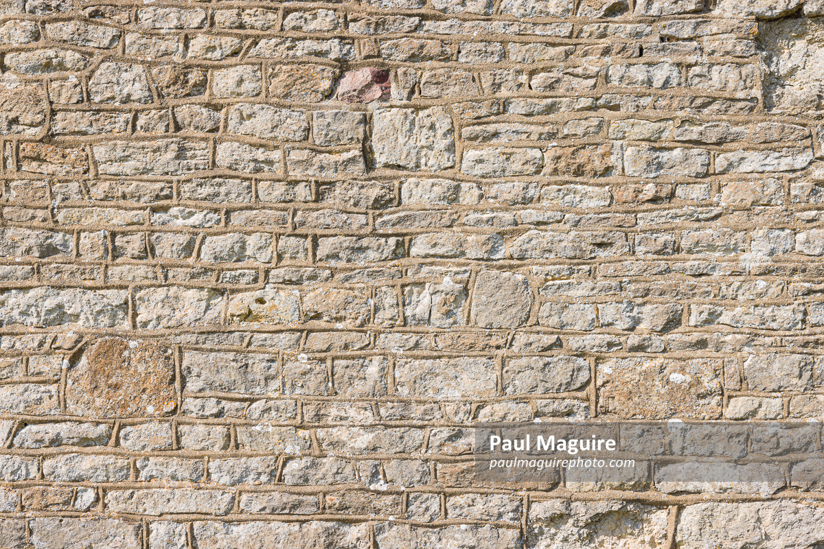 Ancient stone wall pattern or texture, old UK church detail