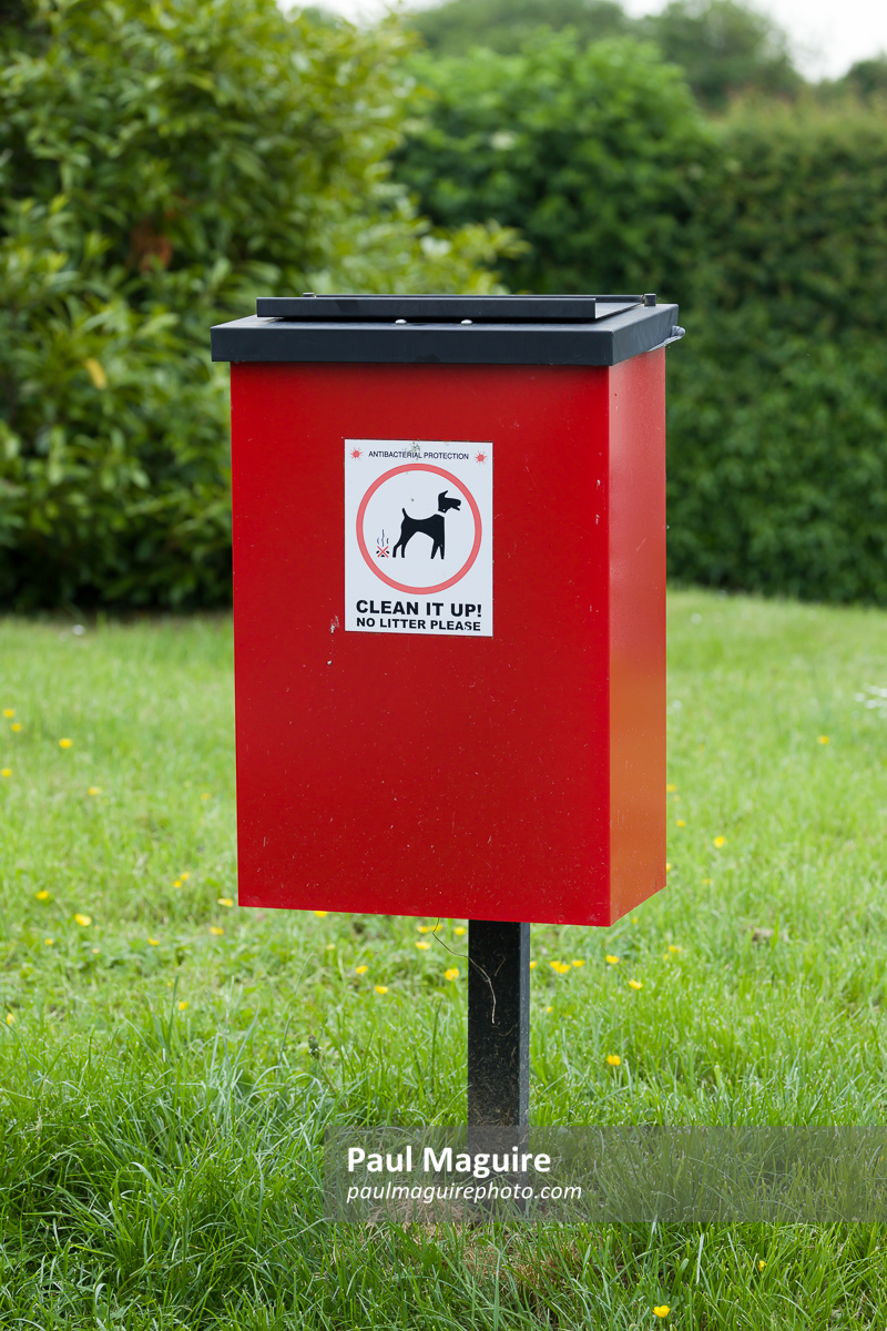 Dog waste bin in park. Council dog poo waste disposal bin, UK