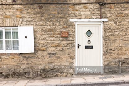 Front door to stone cottage in Dorset, UK