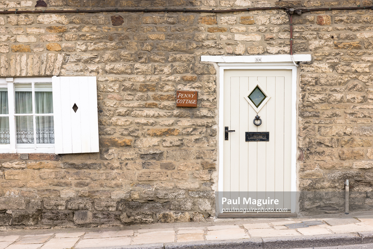 Front door to stone cottage in Dorset, UK