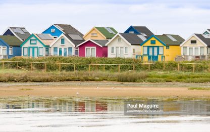 Row of beach houses, holiday homes at Hengistbury Head Dorset UK