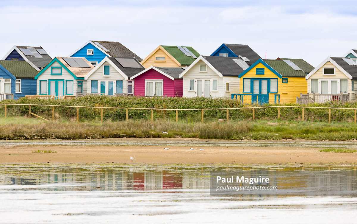 Row of beach houses, holiday homes at Hengistbury Head Dorset UK