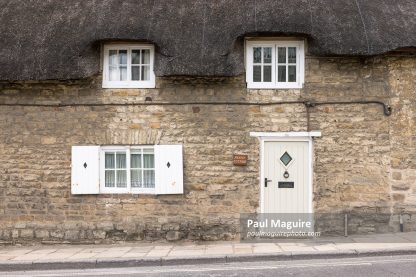 Front of thatched cottage in Corfe Castle, Dorset, UK