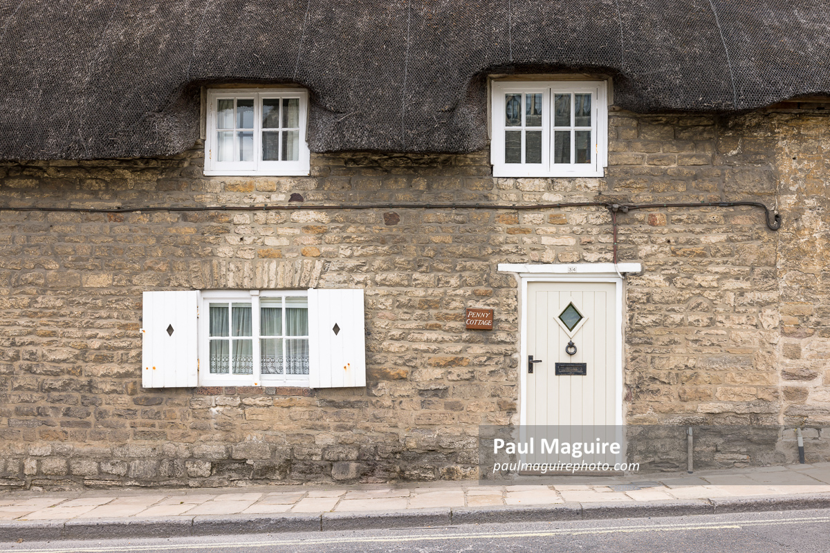 Front of thatched cottage in Corfe Castle, Dorset, UK