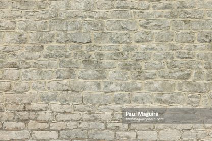Stone wall of an old house. Full frame pattern or texture, UK