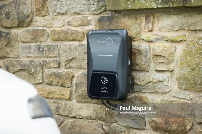 Electric car charging point on driveway at UK home