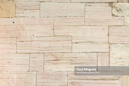 Ancient stone wall of sandstone blocks, pattern or texture, UK