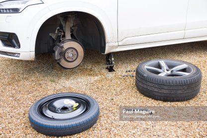 Changing a tyre (tire) on a car, changing wheel with car jack