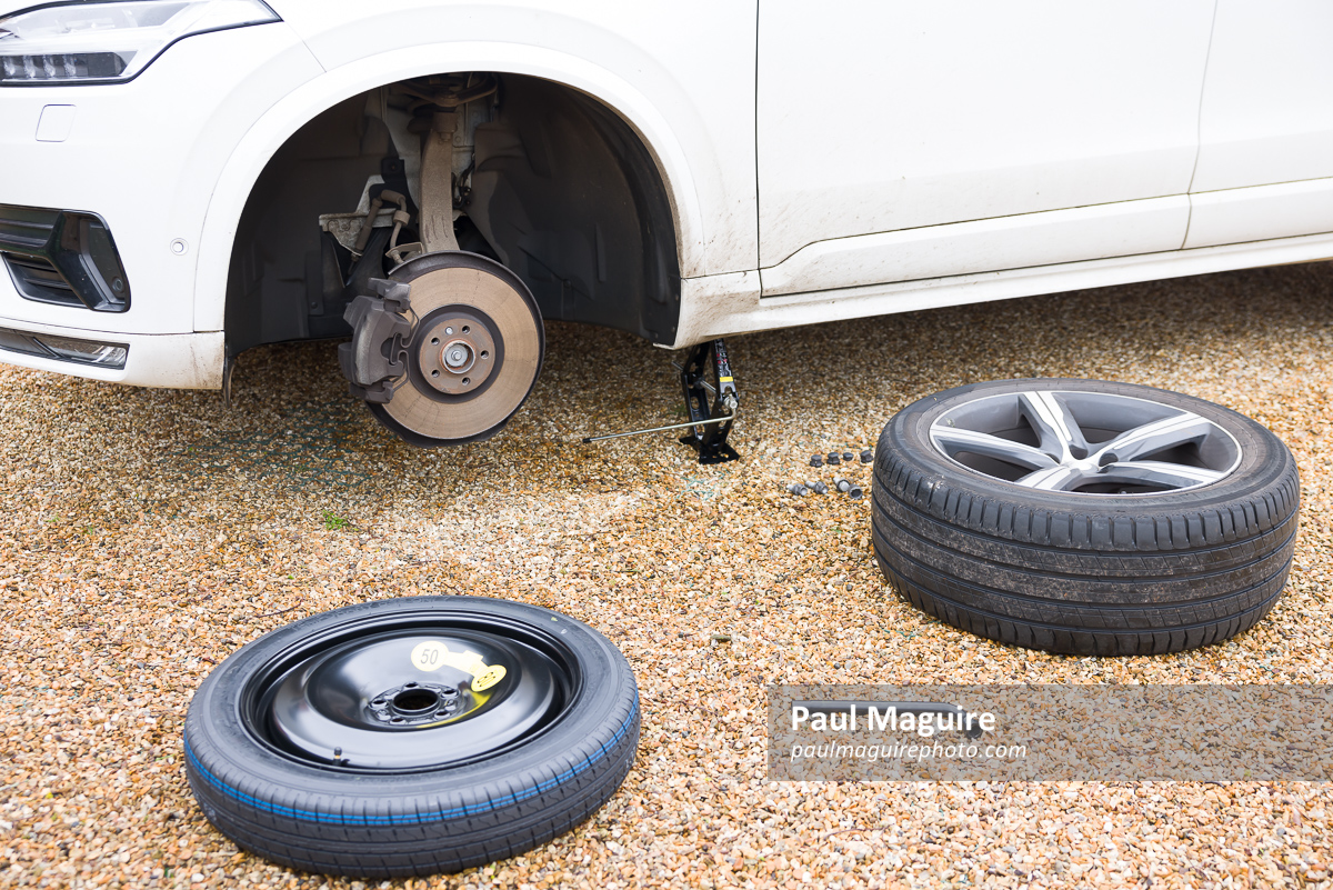 Changing a tyre (tire) on a car, changing wheel with car jack