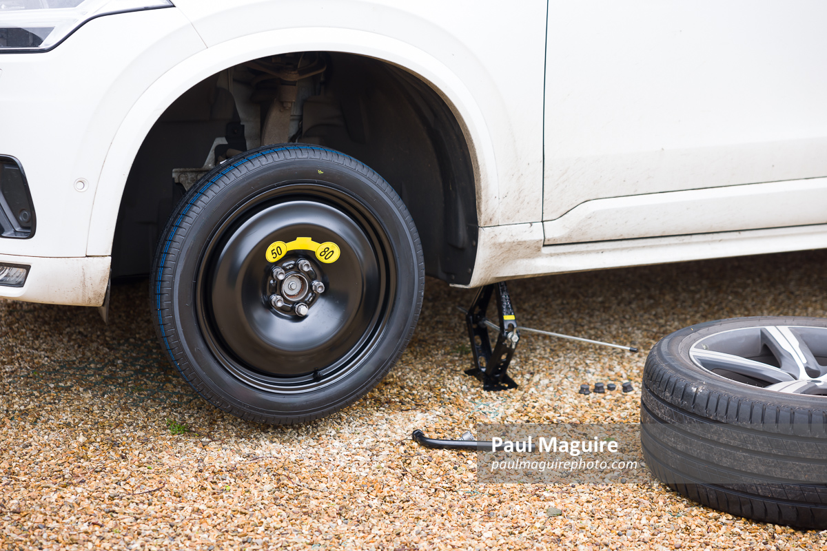 Changing a tyre (tire) on a car, changing wheel with car jack